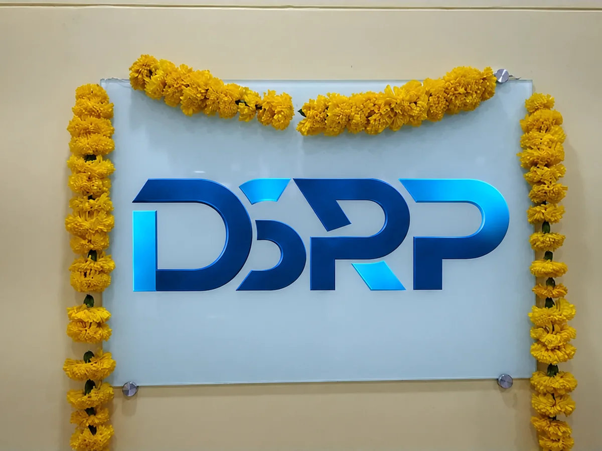 DSRP logo sign at the DSRP office, decorated with marigold garlands